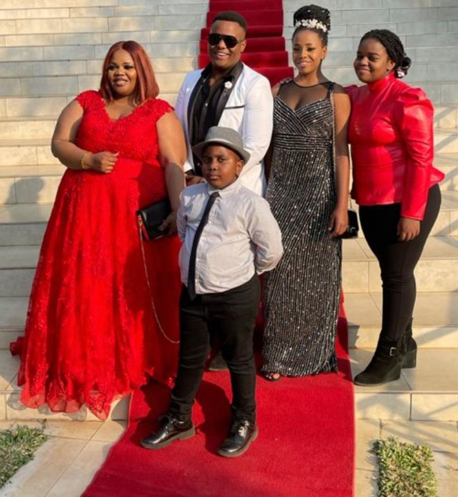 Alice with family on a red carpet